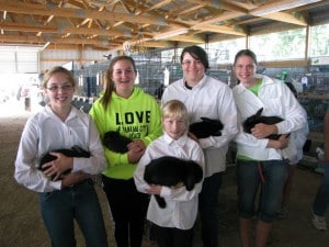 Watertown Badgers members with their rabbits in the Small Animal Building