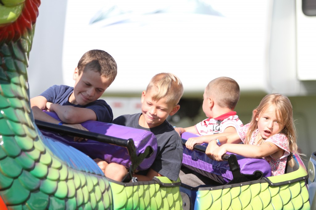 Kids ride the Dragon Roller Coaster at DCFair Beaver Dam WI