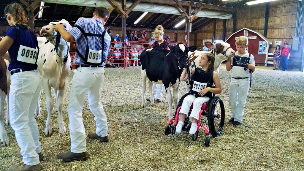 Caroline Powers shows her calf from wheelchair